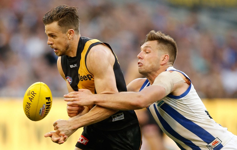 MELBOURNE, AUSTRALIA - SEPTEMBER 13: Brett Deledio of the Tigers is tackled by Shaun Higgins of the Kangaroos during the 2015 AFL First Elimination Final match between the Richmond Tigers and the North Melbourne Kangaroos at the Melbourne Cricket Ground, Melbourne, Australia on September 13, 2015. (Photo by Michael Willson/AFL Media/Getty Images)